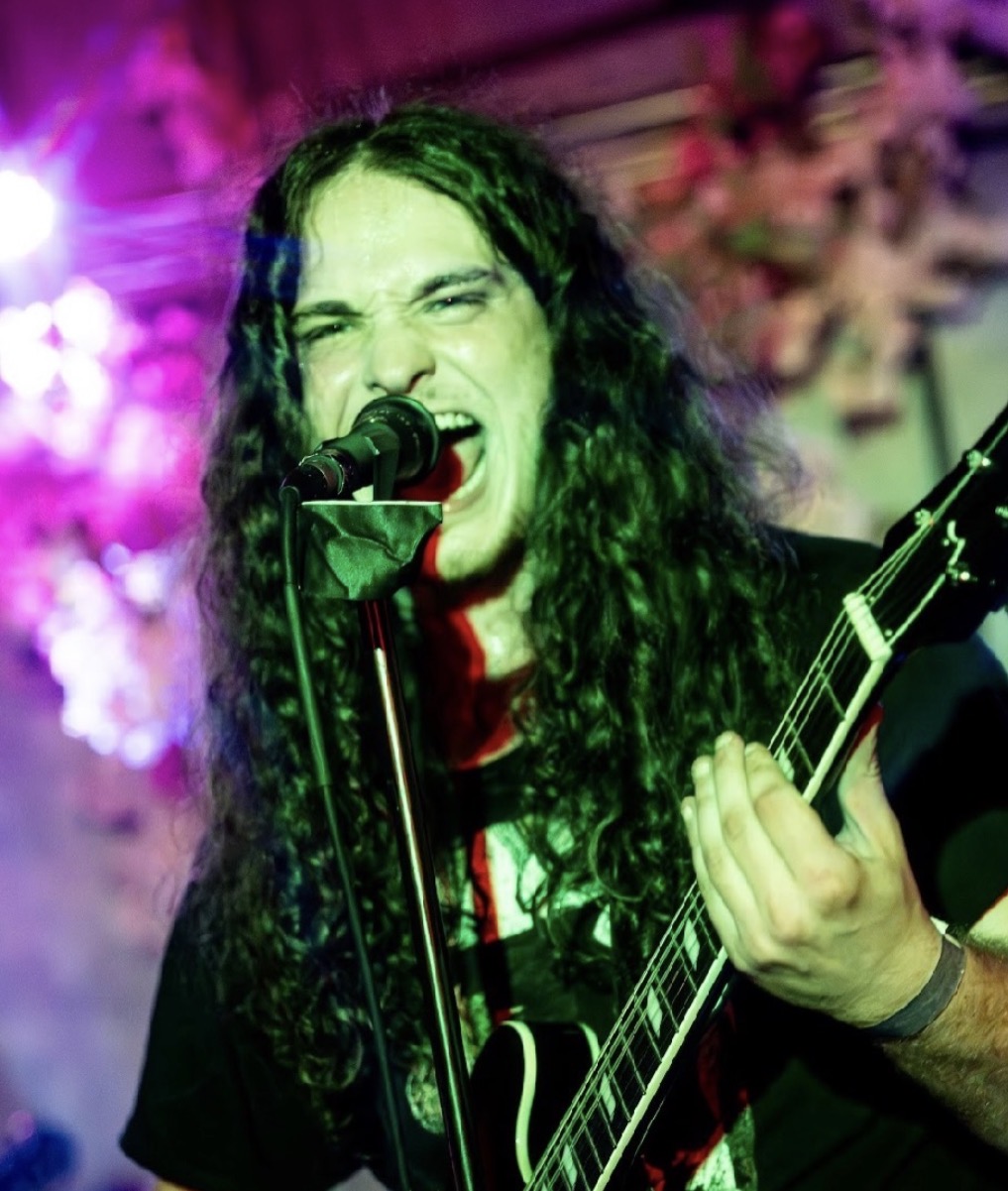 Zombieland — vocalist screaming into the mic, long hair flying