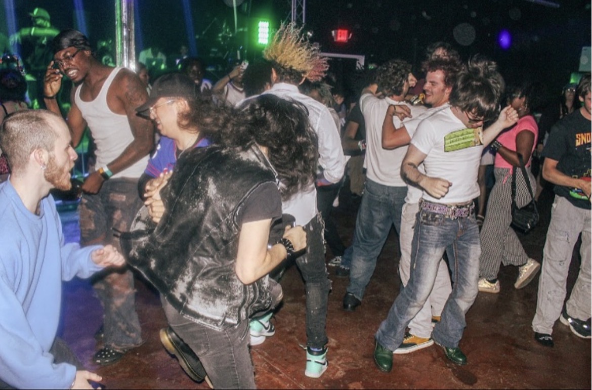 Zombieland — dance floor chaos under green lights