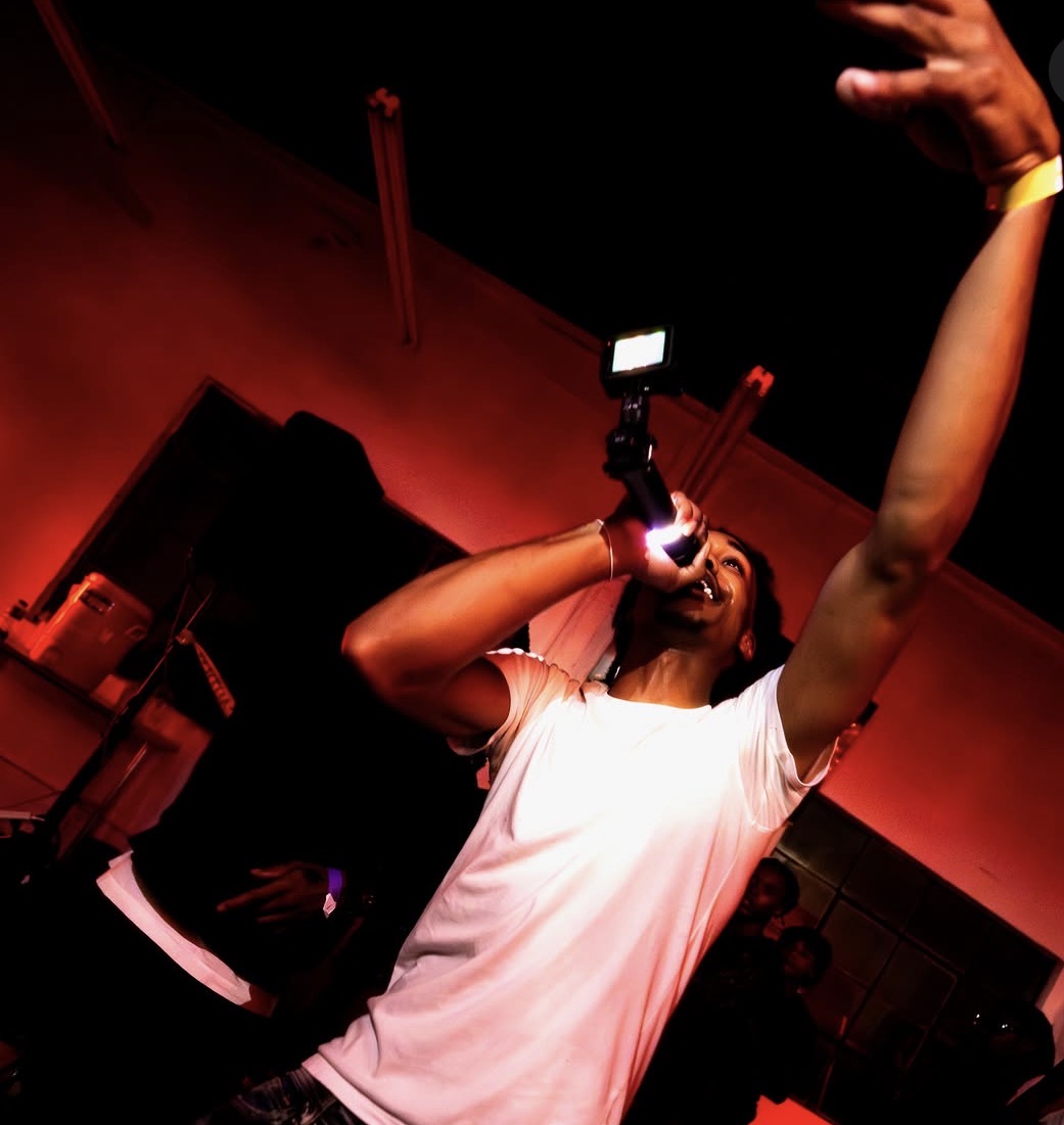 The Rally — performer reaching to the crowd