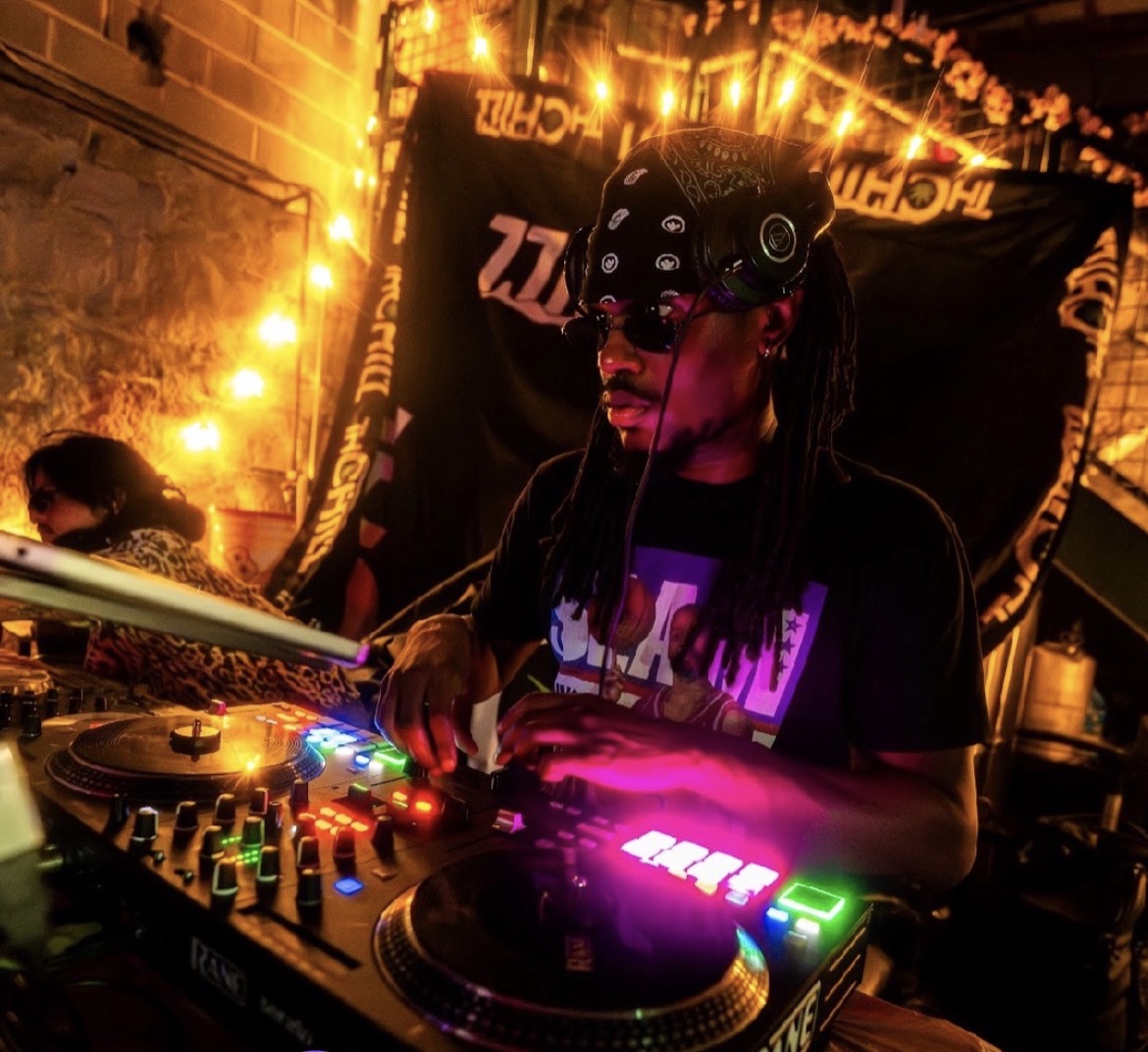 Zombieland — DJ on the decks under warm string lights