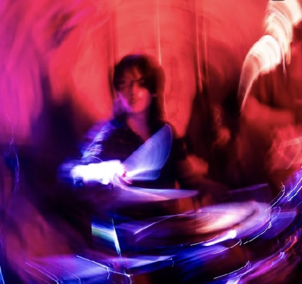 Zombieland — drummer in motion under red and purple haze