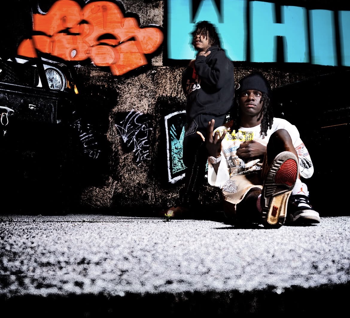 Zombieland — duo on the street with graffiti backdrop