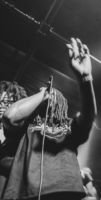 Halloween Riot — artist on the mic, black and white
