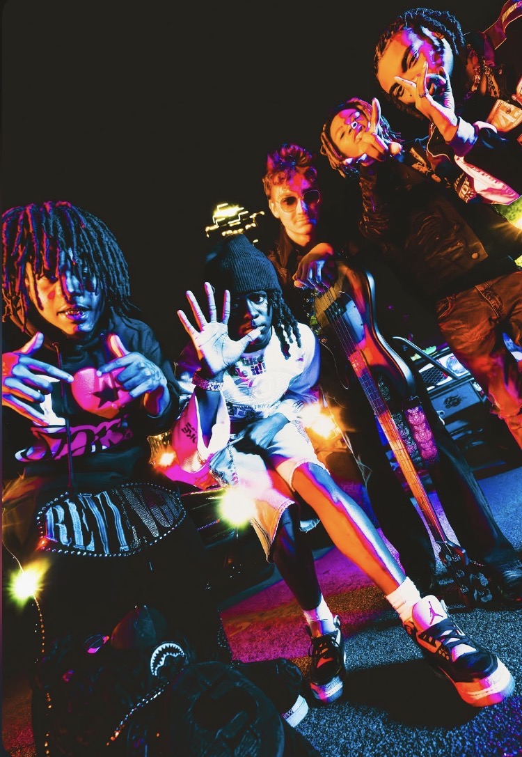 Zombieland — crew posted up under neon city lights